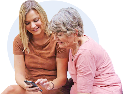 Two women looking at a smartphone together